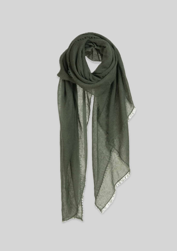 A luxurious large cashmere scarf draped elegantly, showcasing its exquisite craftsmanship and soft texture